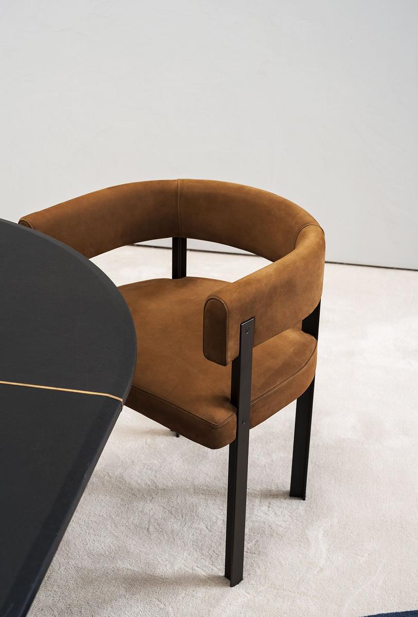 T-CHAIR Upholstered leather chair with armrests