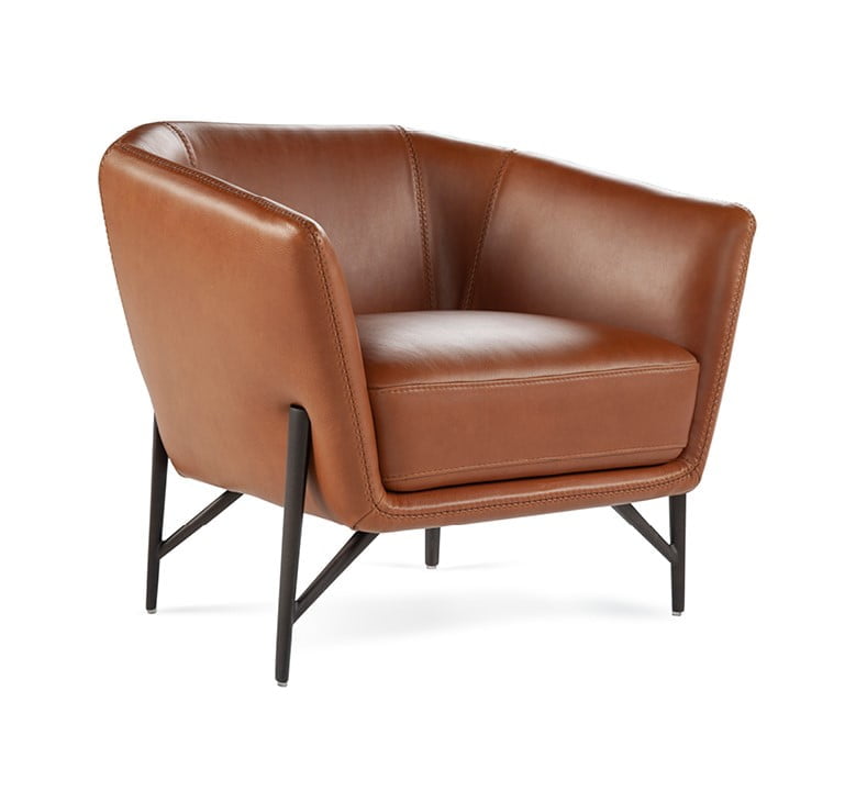 VENERE Contemporary armchair with a slim, enveloping structure and soft cushion for comfort, ideal for space efficiency without compromising on style.