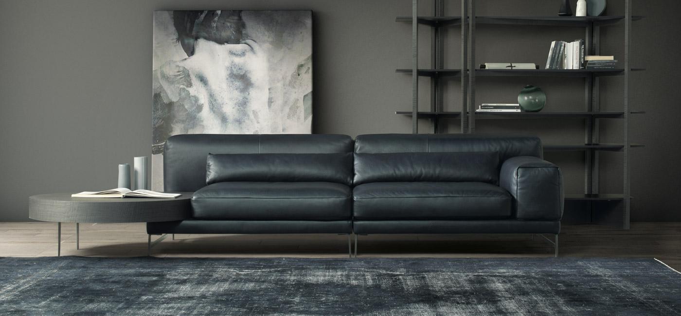 IDO Leather sofa with integrated magazine rack