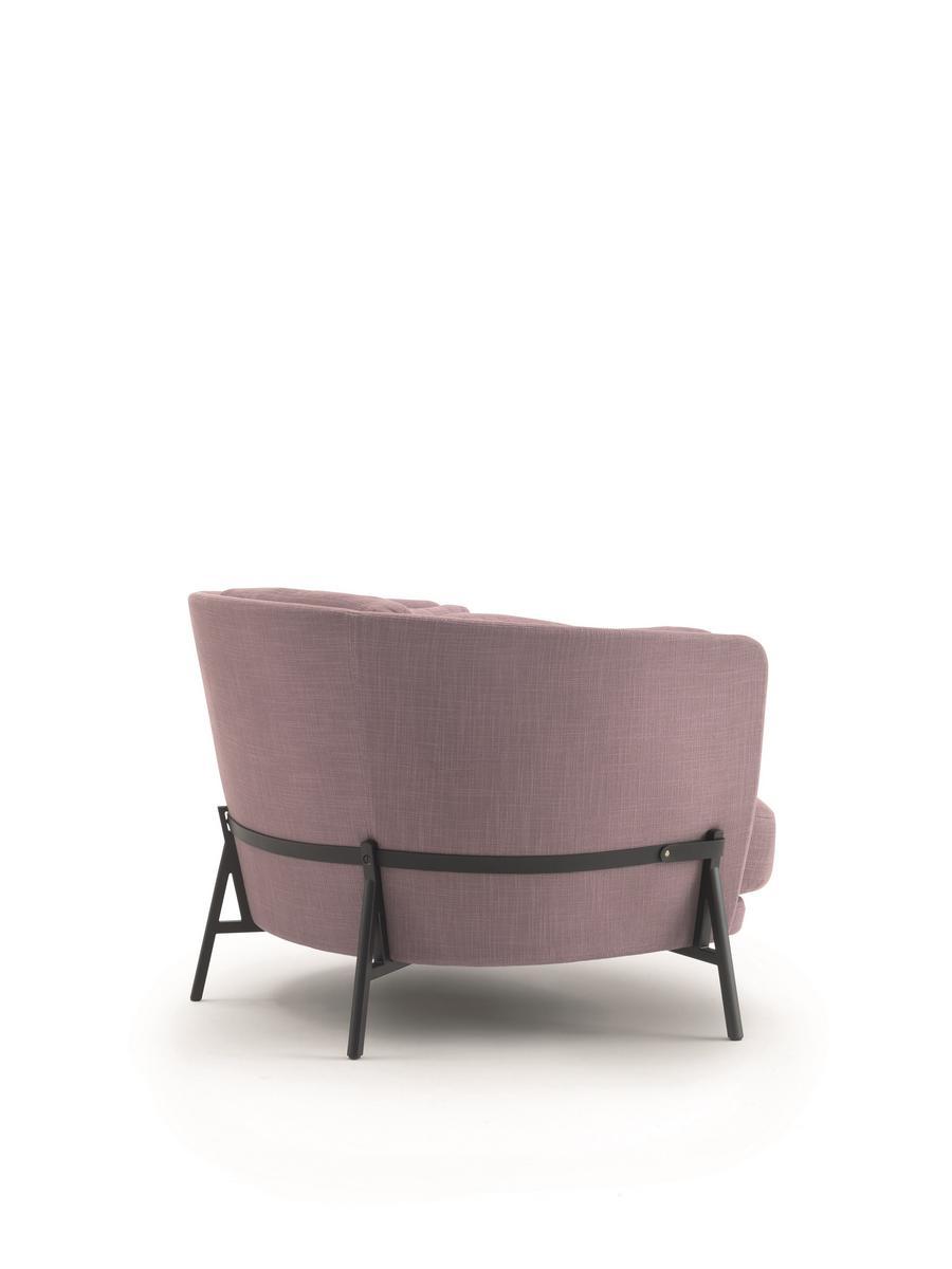 CRADLE Fabric armchair with armrests with integrated magazine rack