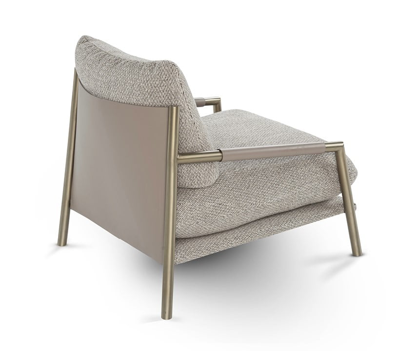 NORMAN The Norman armchair offers a unique, forward-tilting design with a metal frame, regenerated leather upholstery, and a cushion-back for stylish, informal comfort.