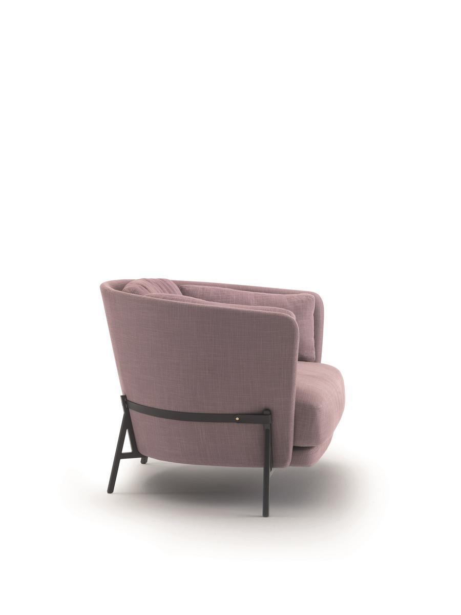 CRADLE Fabric armchair with armrests with integrated magazine rack