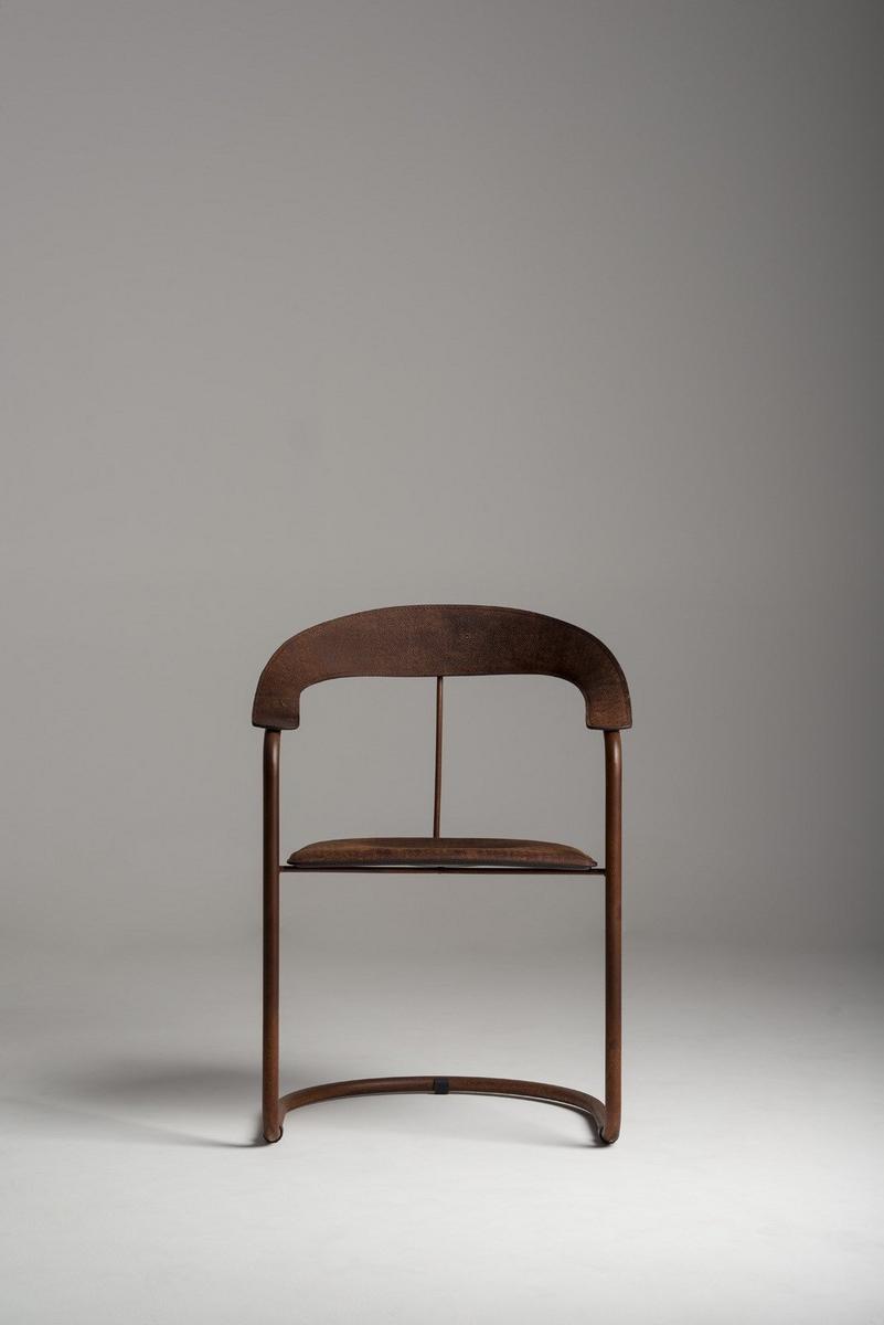 PARABOLICA Tanned leather and Corten™ chair with armrests