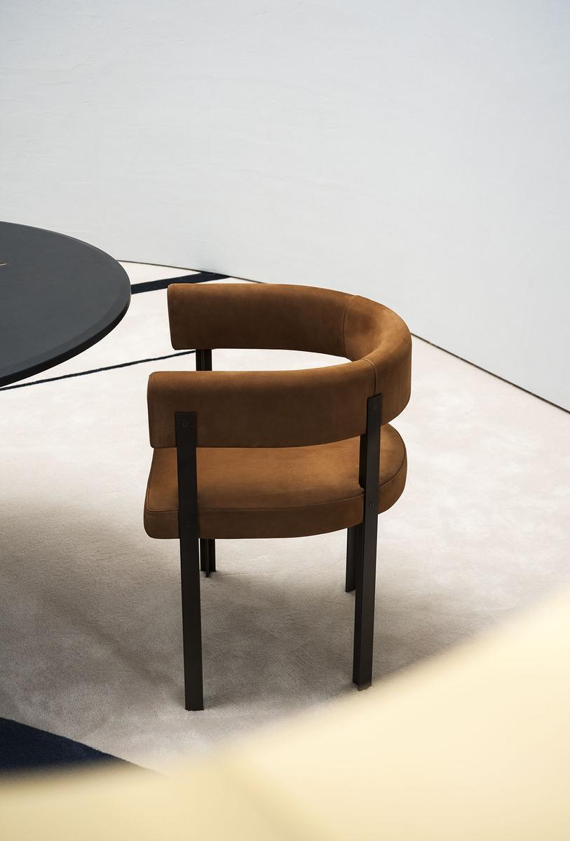 T-CHAIR Upholstered leather chair with armrests