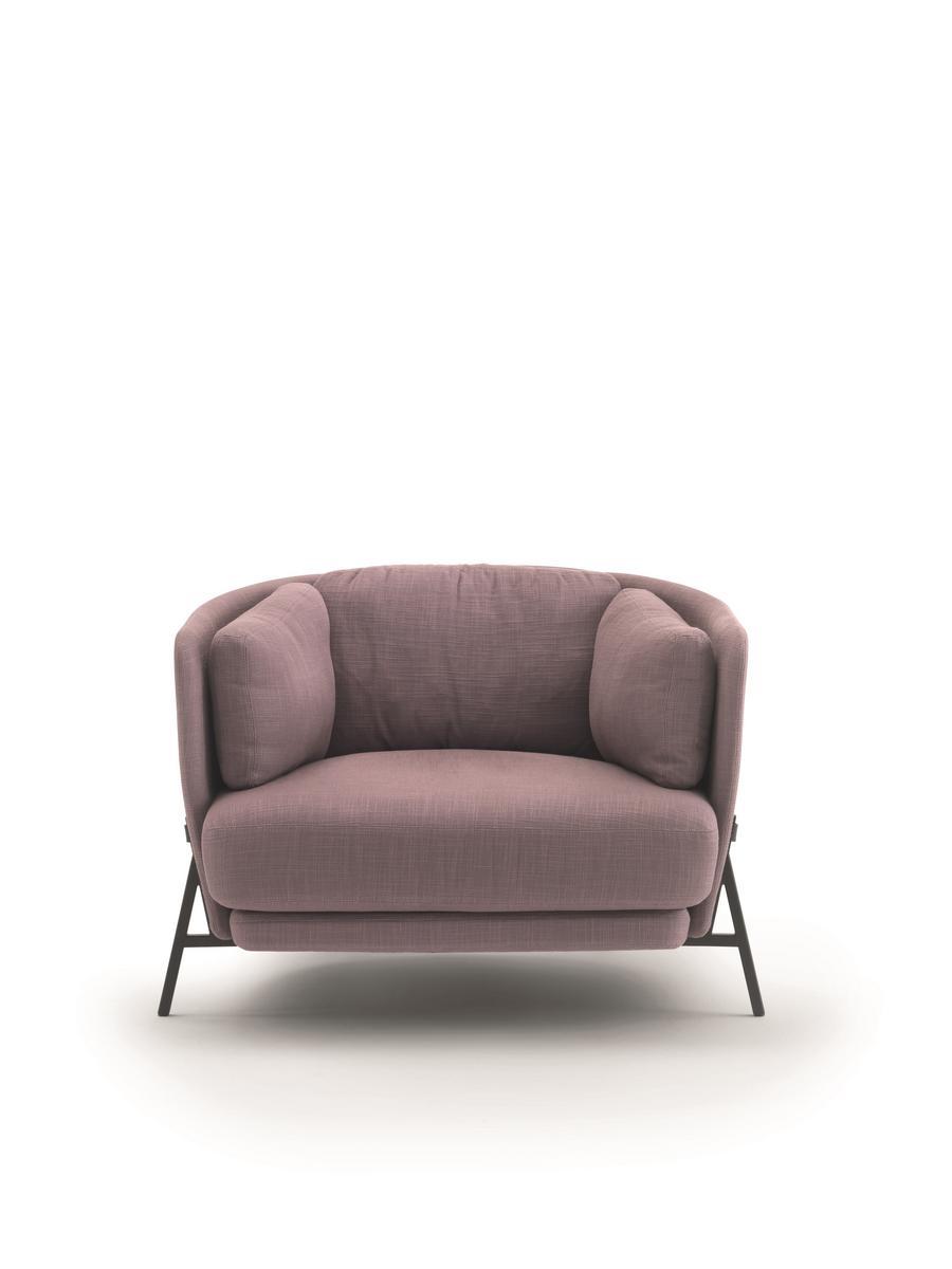 CRADLE Fabric armchair with armrests with integrated magazine rack