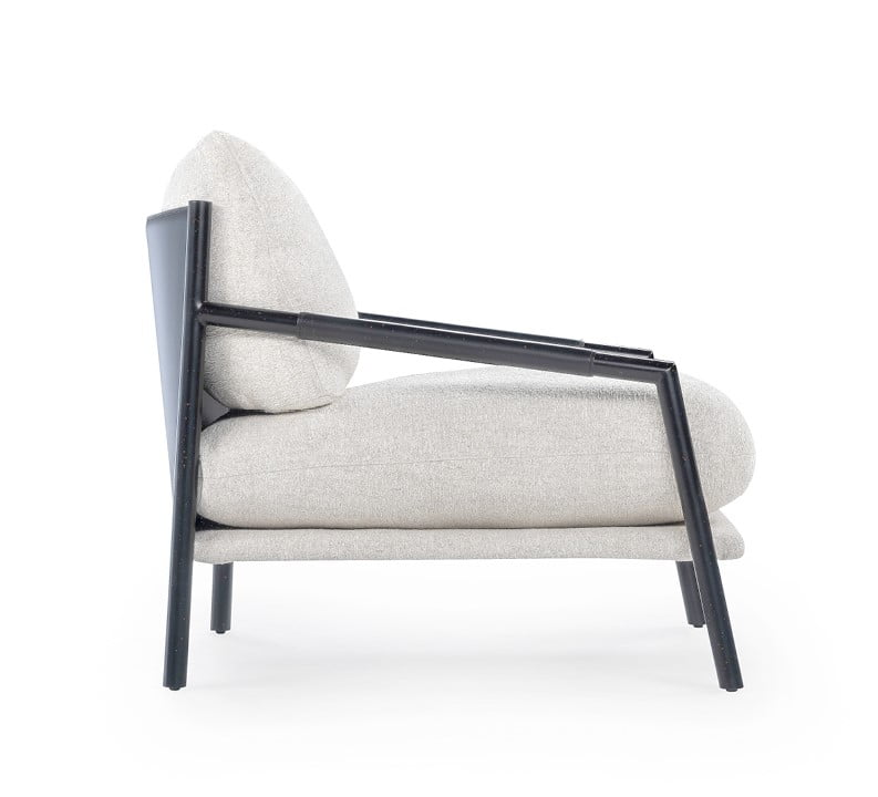 NORMAN The Norman armchair offers a unique, forward-tilting design with a metal frame, regenerated leather upholstery, and a cushion-back for stylish, informal comfort.