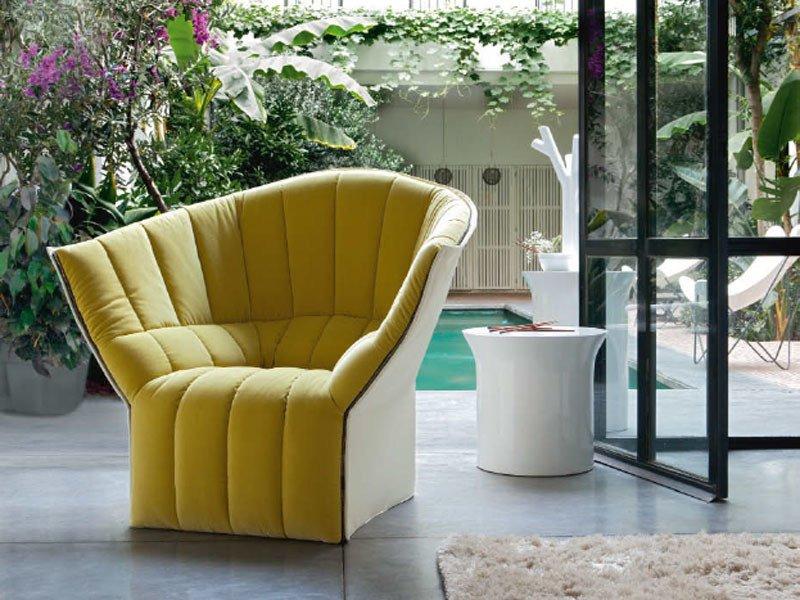 MOËL Upholstered fabric armchair with armrests
